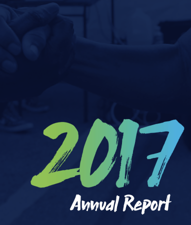 Two people clasp hands in a handshake above the words "2017 Annual Report" in large, bold text.
