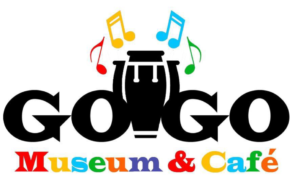 The logo features the text "GoGo Museum & Café" with a conga drum in the center and colorful music notes above it.