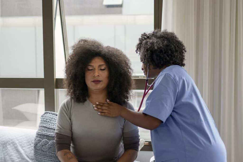 Nurse Examining Patient