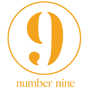 A large orange number nine inside a circle, with the words “number nine” written below in orange text, embodies the spirit of community—echoing the message of Whitman Walker stand with us.