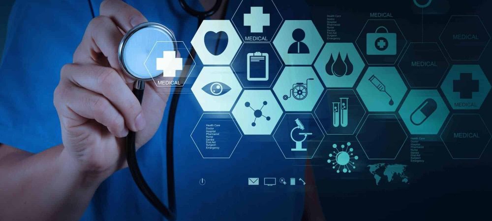 A person in blue scrubs holds a stethoscope near a digital interface displaying medical icons and data charts, reminiscent of scenes discussed in the Whitman Walker Audacy radio interview.