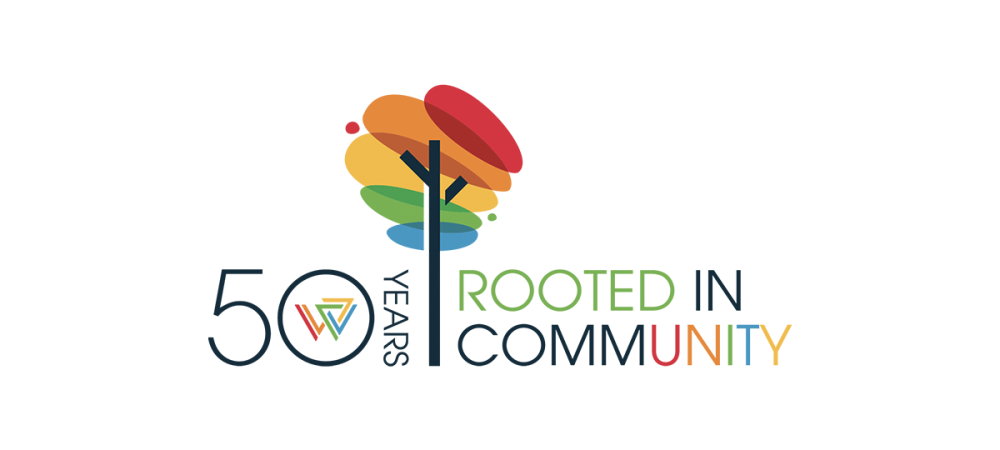 Logo showing a stylized tree with multicolored leaves, “50 Years” text, and the phrase “Rooted in Community” in green, blue, and orange letters.